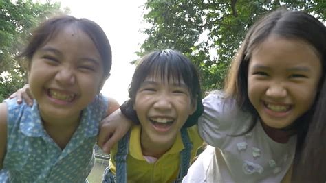 Clear up any acne on your face. Slow Motion Shot : Group Of Little Happy Asian Girls ...