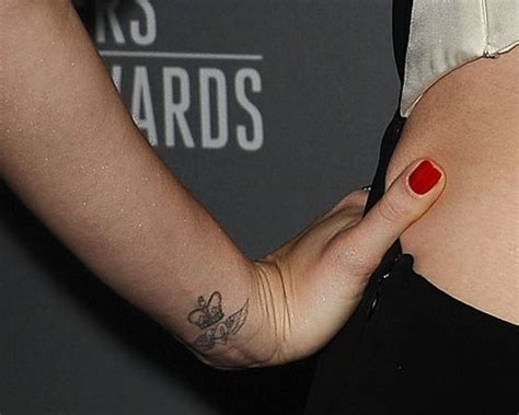 The lily tattoo designs are mainly chosen by girls but guys can try it too. Lily Collins Wrist Tattoo | Tatuajes