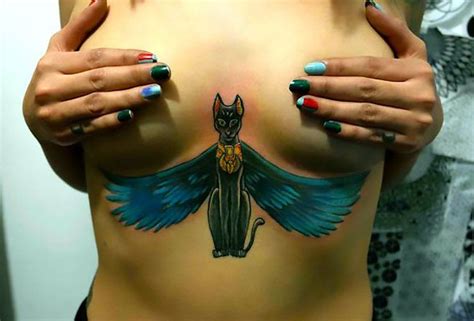 Applying this type of tattoo the master should take into account the exact size, shape and individual characteristics of the breast to achieve more. Egyptian Cat Under Breast Tattoo Idea