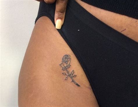 Yellow rose tattoo is a symbolism of friendship. Rose bikini tattoo, in love with it! | Bikini line tattoo ...
