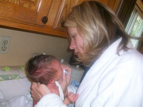 Carefully avoid the umbilical cord. The Diehl Family: Griffin's 1st Bath at Home!