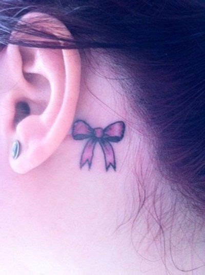 Although generally a ribbon tattoo represents charm and beauty, however, ribbon tattoos hold different significance for each of its wearers. pink bow behind the ear tattoo | Pink bow tattoos, Behind ...