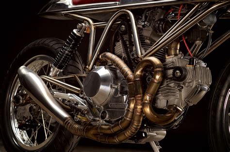 Older ducati 900ss were notorious for snapping their cylinder head studs and bending chain adjusting bolts. Ducati 900SS SP J63 - RocketGarage - Cafe Racer Magazine