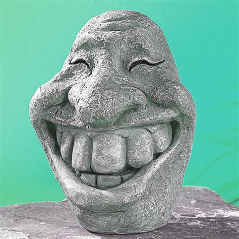 Figurine décorative en pierre pour le jardin - tête souriante