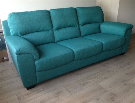 Elevate the style of your living room or family room with a pretty turquoise sofa. Turquoise sofa | Turquoise sofa, Sofa, Home decor