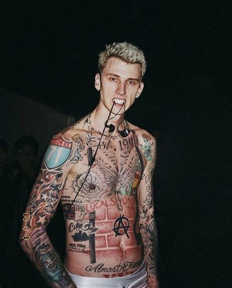 This is a temporary tattoo. machine gun kelly, rapper with full body tattoo trend ...