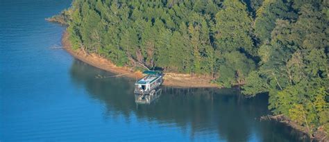 Relax on the deck in one of a thousand private coves while the kids spash into beautiful dale hollow lake off the water slide. Dale Hollow Lake Houseboat Rentals and Vacation Information