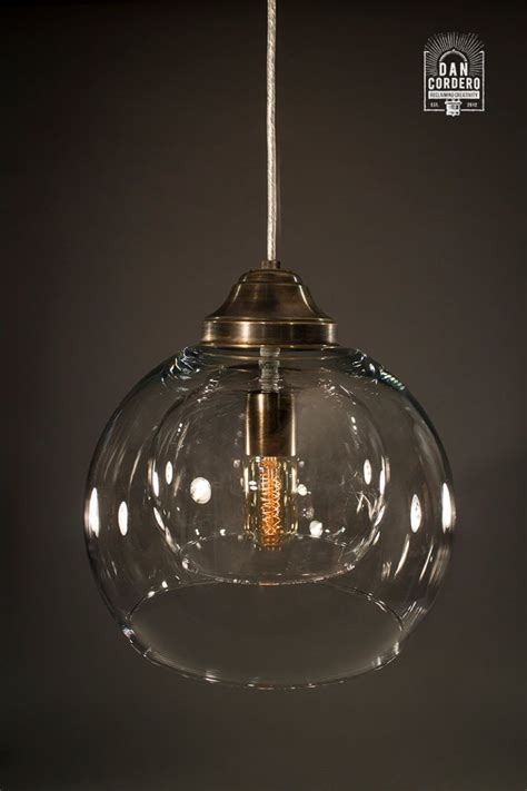 A pendant lamp provides overhead light to a section of a room, while also adding to the overall ambiance. Glass Pendant Light Fixture | Aged Brass | Double Globe ...