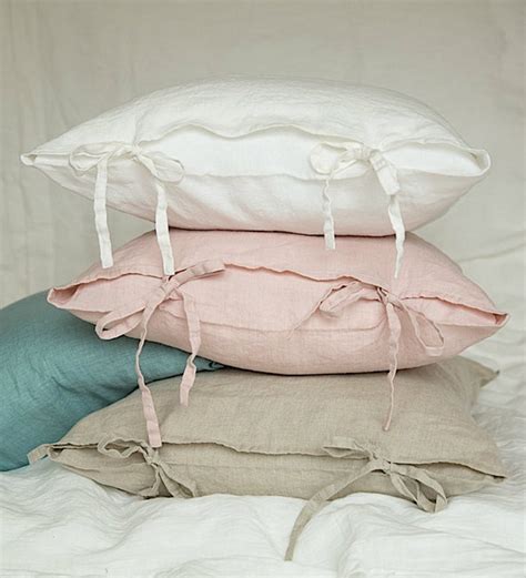 The worn side chair in her arms needed a new cushion, some updated fabric, and a coat of paint. Linen pillowcase with skinny ties. Washed bow tie pillow ...