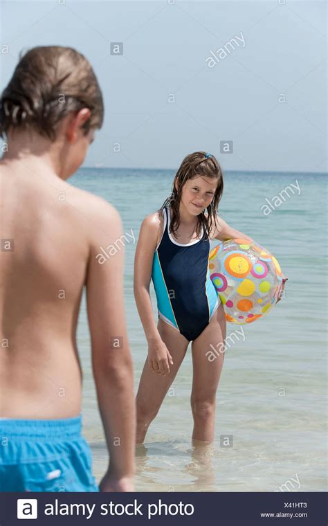 Post photos available for purchase from the alamy stock photography company. Spain, Mallorca, Children with beach ball on beach Stock ...