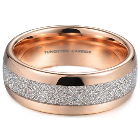 Our stardust rings feature meteorite shavings in a variety of colors. Meteorite Inlay Tungsten Carbide and Rose Gold Tone Unisex Wedding Ring