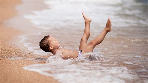 Bathe involves using water, and water in dreams, since ancient times is well known meanings: Baby Boy Enjoying Beach Bathing Wallpaper | Beach bathing ...