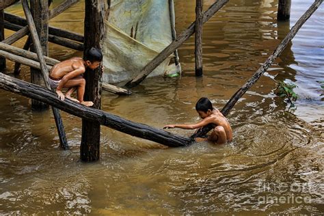 Barechestedness is the state of a man or boy wearing no clothes above the waist, exposing the upper torso. Boys swimming Tonle Sap Lake Photograph by Chuck Kuhn