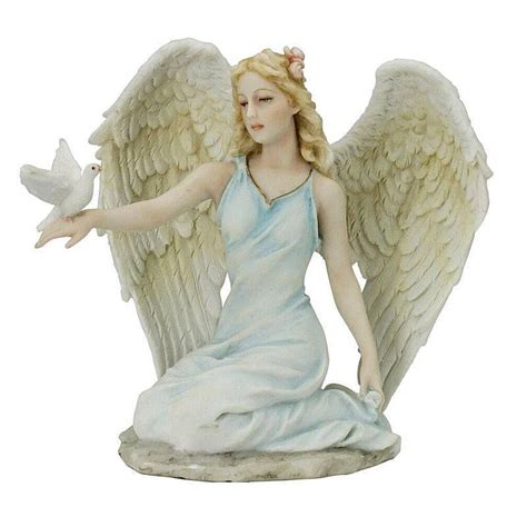 Glossy porcelain figurine of two pigeons holding a white cloth full of handmade flowers. Roman Angel Figurine with Dove - $30.00