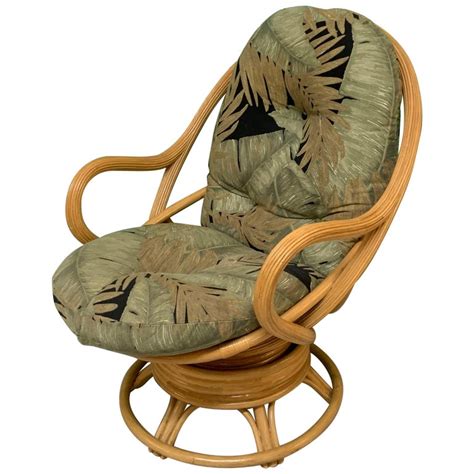 It has been reupholstered in an ivory color boucle fabric with a dark brown velvet trim. Vintage Modern Rattan Swivel Mamasan Bucket Lounge Chair ...