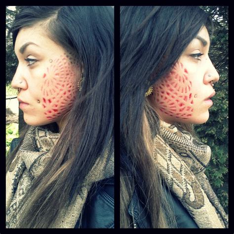 A way of permentally marking the body by cutting the skin. Facial scarification update n_n : bodymods