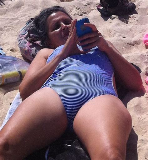 Usually when you wear tight clothes. Mom with sexy cameltoe on beach - Sexy Candid Girls