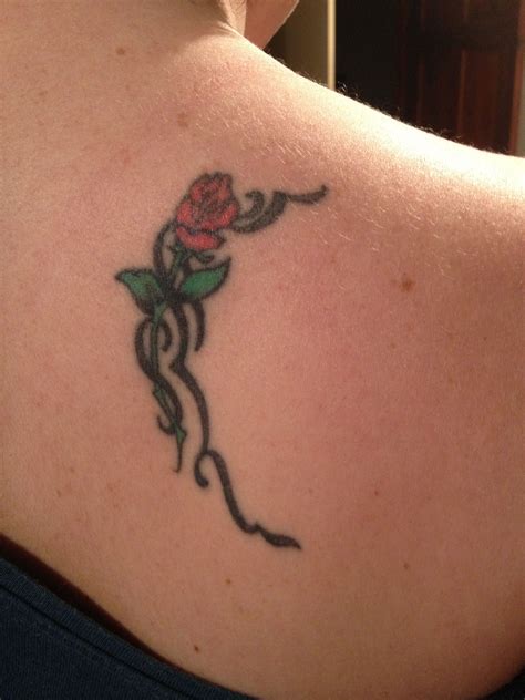 This pink and purple rose is fit for a fairy queen. Rose shoulder blade tattoo | Shoulder blade tattoo, Blade ...