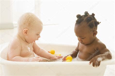 Eucalyptus remedy plant based shampoo, bubble bath & wash. Two babies in bubble bath — Stock Photo © monkeybusiness ...