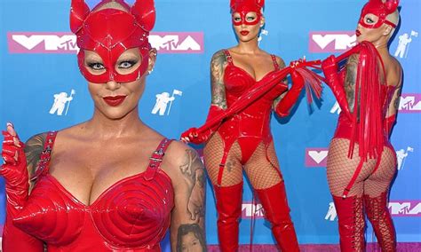 1 2 3 4 5. Amber Rose flaunts her hourglass figure in a red devil ...