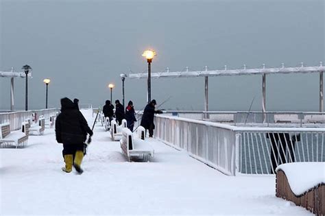 The camera sweeps across the scene from a vantage point well above the area. Steeplechase Pier | Amusing the Zillion