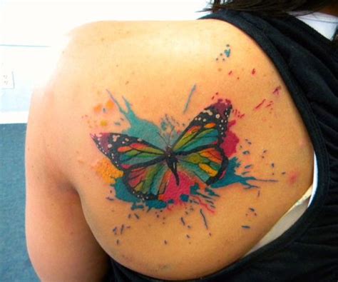 Watercolor tattoos expertly blend different hues, creating a piece that is bright and bold. Watercolor butterfly tattoo - Tattooimages.biz