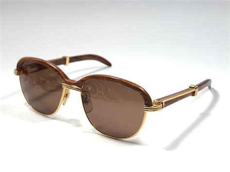 Maybe you would like to learn more about one of these? Cartier Wood Malmaison Precious Light Wood and Gold 54mm ...