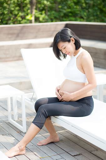 Maybe you would like to learn more about one of these? Portrait Of Beautiful Pregnant Asian Young Woman Relax In ...