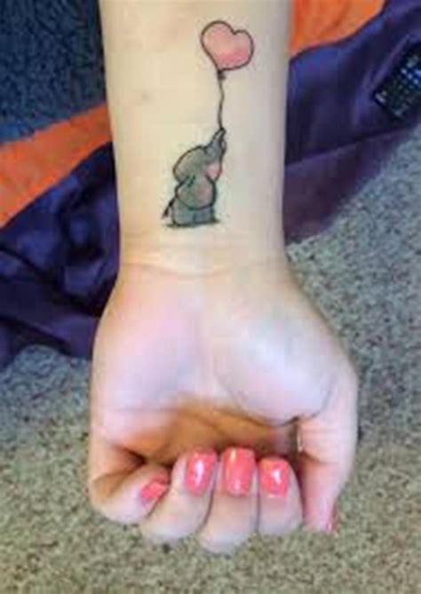 Small elephant tattoo on hand. 14 Animals Wrist Tattoos