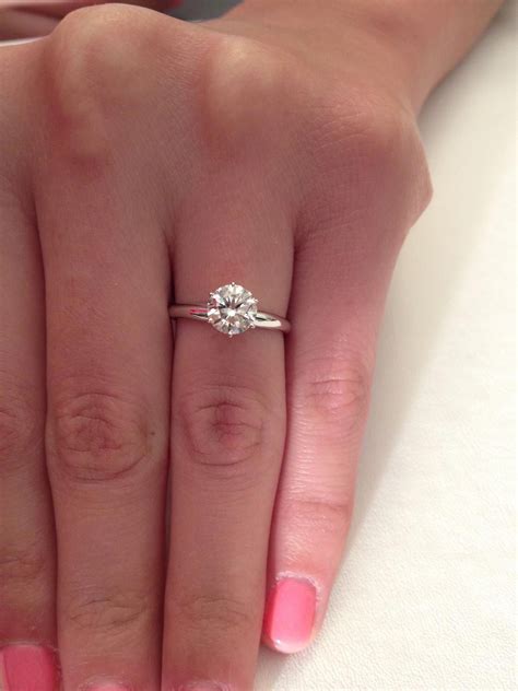 Round engagement rings are the choice of fashionable couples. Something about a round solitaire ring is just simply ...