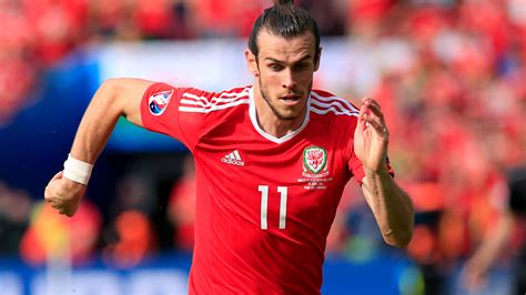 But gareth bale is facing a backlash from the club's fans after celebrating with a flag that suggests he prefers appearing for wales and playing golf ahead of in that order': Gareth Bale arrives in Dornoch to enjoy a round of golf