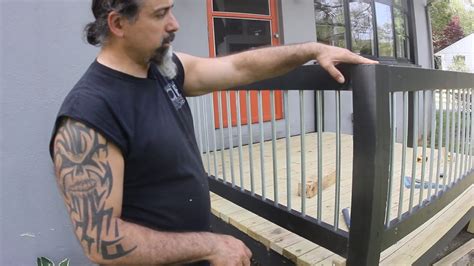 After mixing a batch of concrete, shovel it into the holes and lop off the excess using a spare wood stake. Do it Yourself Modern Deck Railing on a Budget - YouTube