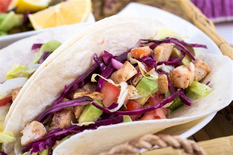 Warm the tacos in a dry frying pan, then divide among 4 plates. Grilled Fish Tacos with Lime-Cabbage Slaw - Lighthouse ...