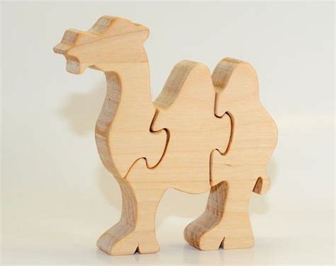 Along the way, they evolved into the camels we know today. Wood puzzle Family Camels toy. Wooden handmade toys wooden ...