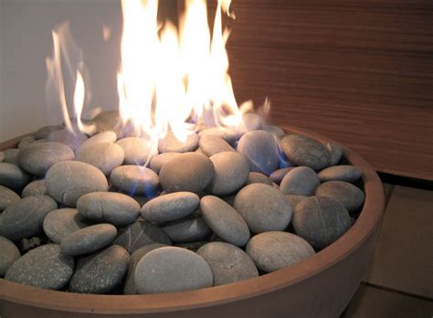 Lava rock is suited for most all fire pits. Hemi 26" Fire Pit with river rock in Truffle with dark gre ...