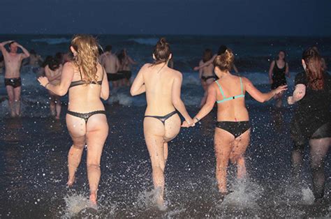One volunteer has dwarfism, while another is. Skinny dippers at St Andrews University strip off as ...
