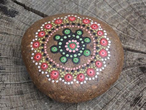 Go from coarse to medium to fine grit as the old finish or problems with the wood are addressed. a mandala stone painted by hand, Acrylic paint, covered ...
