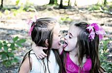 tongues sisters children playfully