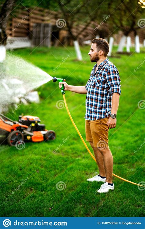 When we are experiencing extreme heat). Close Up Details Of Manual Hose Lawn Irrigation. Details Of Irrigation Stock Photo - Image of ...