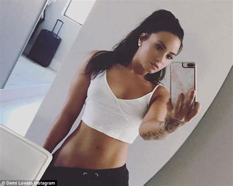 Admitting that she won't made her bridesmaids were traditionally matching dresses, she said: Demi Lovato shows off flat belly in mirror selfie | Daily ...
