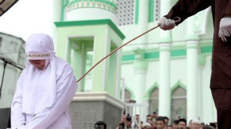 Spankers and spankee in malaysia. Malaysian Muslim lesbian couple caned in public punishment ...