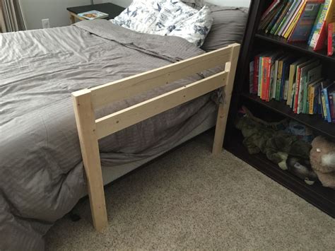 I saw a couple ideas regurgitated. DIY Toddler Bed Rail | Free Plans | Built for under $15 | Diy toddler bed, Bed rails for ...