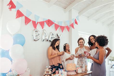 Tired of buying ordinary baby shower gifts? Pregnant Woman Celebrating Baby Shower With Friends Stock ...