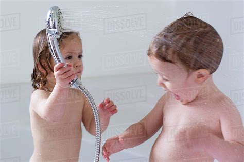 New users enjoy 60% off. Children playing in bathtub - Stock Photo - Dissolve