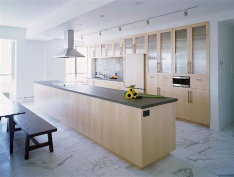 This white kitchen uses arabescus white marble on both its countertop and the backsplash. When And Where Can Marble Floors Become An Elegant Design ...