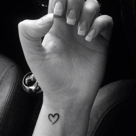 Heart tattoos are a beautiful way to remember loved ones, savor a memory of a past romance or signify a time of brokenness. Heart tattoos on wrist, Heart and Small heart tattoos on ...
