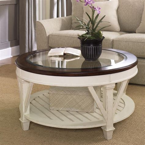 Coffee table can make or break a place. stylish round coffee table with white wooden bases and ...