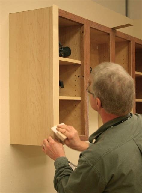 Cabinet refacing basically replaces the veneer on the visible surfaces of the cabinet while leaving the structural aspects intact. Cabinet Refacing Installation smoothing the veneer with smoothing blade. | Veneers, Learn ...