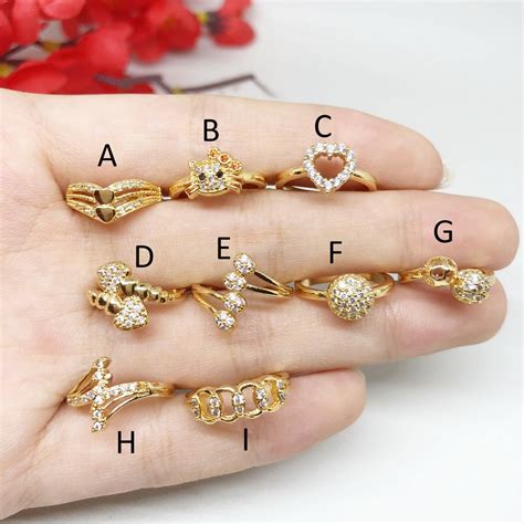 Cincin kawin emas 4 ini menggunakan bahan dasar emas putih kombinasi rose gold dengan tambahan berlian di bagian cincin wanita menjadi terlihat manis. Xuping Cincin Anak Cantik Warna Gold Emas - BR324 | Shopee ...