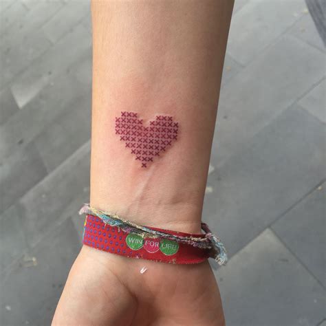 The beautiful high quality tattoos, perfect accessories on your body, harry to try it. cross stitch tattoo / evakrbdk | Red heart tattoos, Heart ...